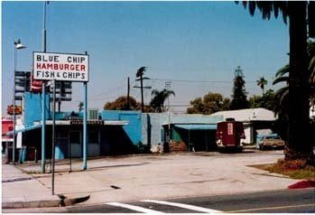 Faded archival photo of the original Blue Chip Hamburger and Fish and Chips stand, painted blue